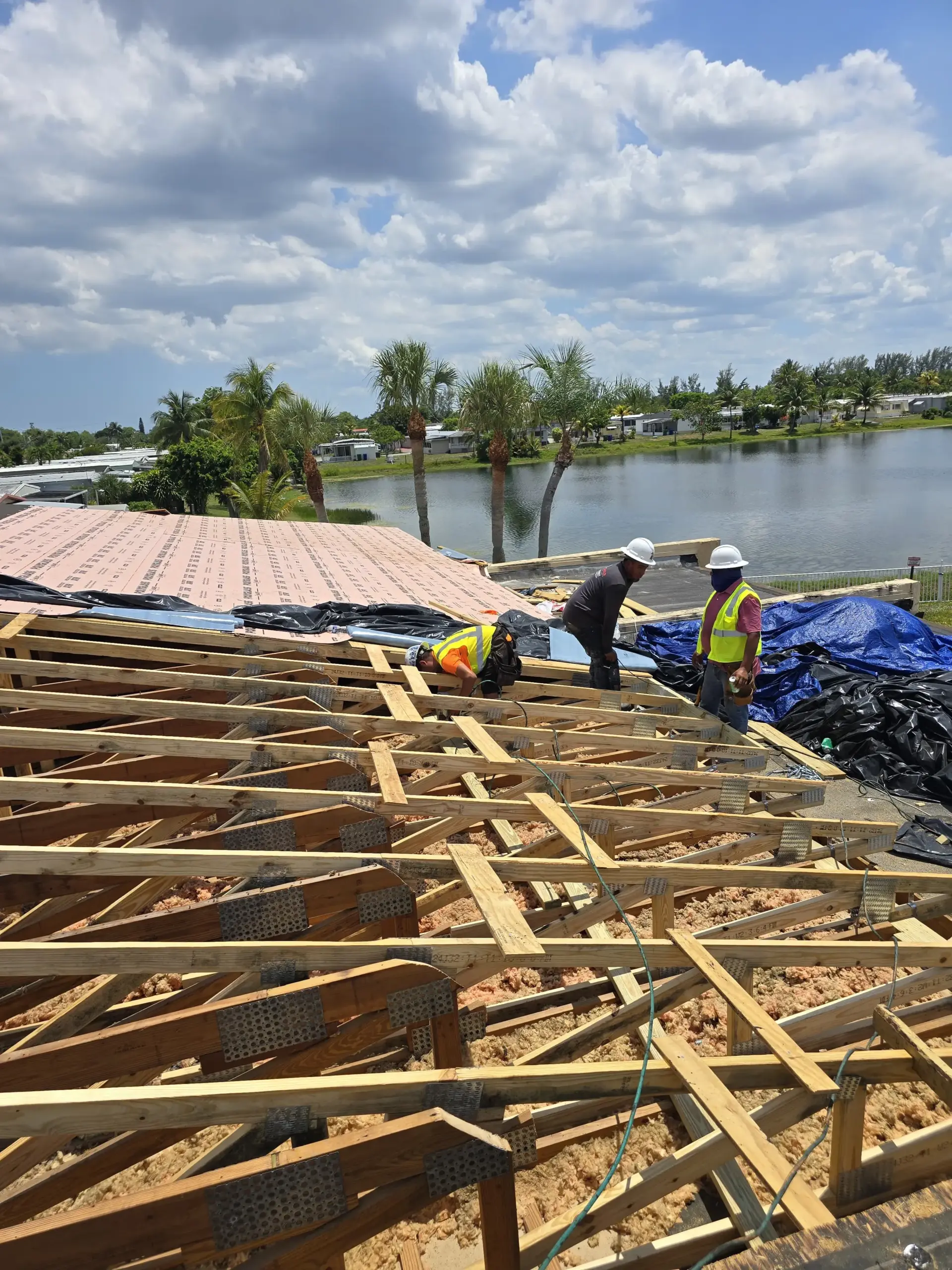 ACP Roofing crew performing active roof replacement work